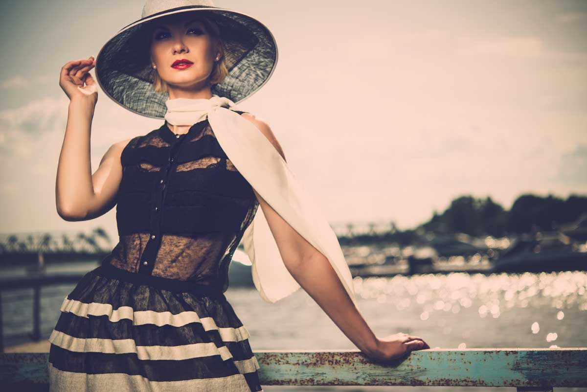 woman-in-white-hat-and-scarf-standing-near-old-pie-2026-03-09-23-10-23-utc