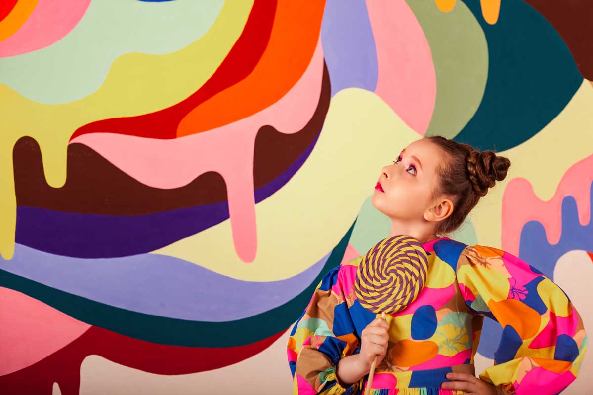 stylish-little-girl-posing-with-round-large-lollip-2026-03-24-02-18-07-utc